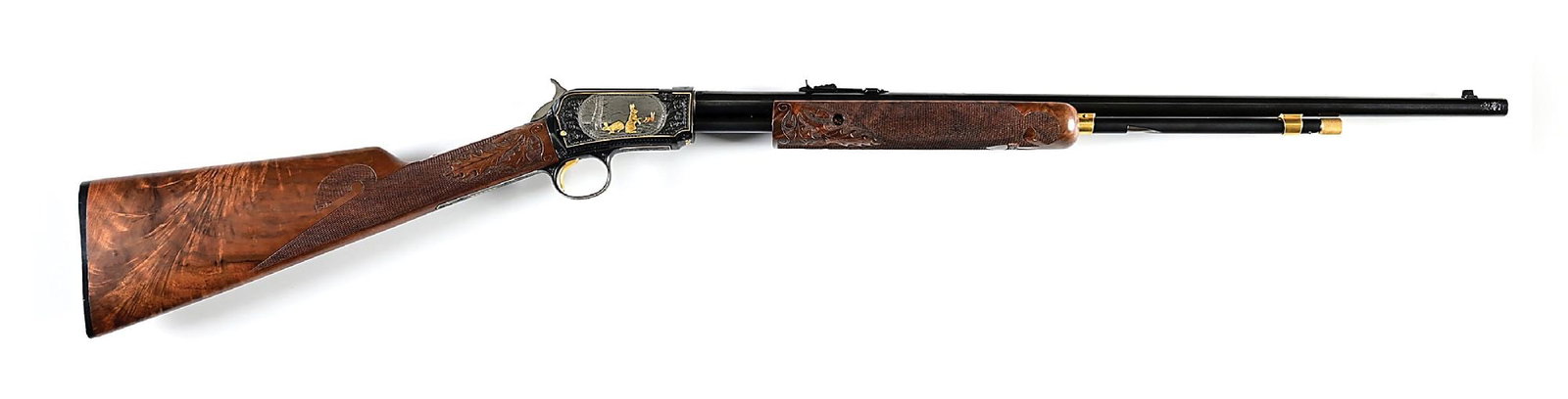 (C) JOHN KUSMIT ENGRAVED WINCHESTER MODEL 62A .22 SHORT SLIDE ACTION RIFLE.: Manufactured 1949, chambered in .22 Short with a triangular Gallery pattern magazine loading port. Engraved and signed by Master Engraver John Kusmit, father of Nick Kusmit, with profuse scrolls and f