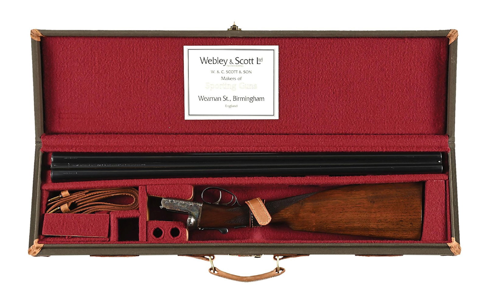 (C) CASED WEBLEY & SCOTT 700 12 GAUGE SIDE BY SIDE SHOTGUN.: Factory cased Webley Model 700 12 bore double with blue and case color finishes with richly figured checkered walnut stocks. Manufactured in 1973. Blued barrels with smooth concave rib engraved for re