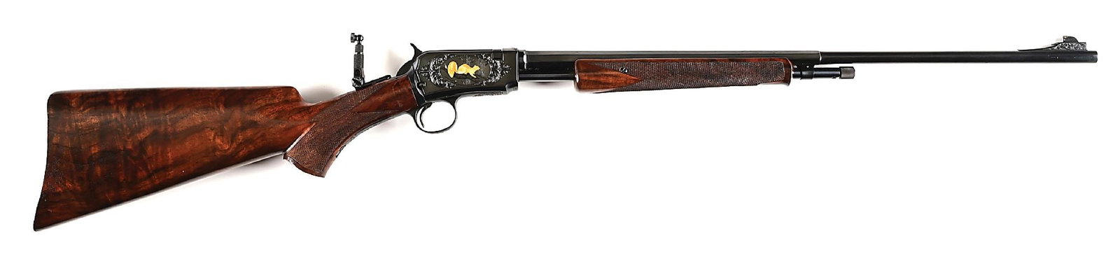 (C) GOLD INLAID AND ENGRAVED WINCHESTER MODEL 62 SLIDE ACTION RIFLE.: Manufactured 1949. Custom half octagon barrel with integral ramped front sight with removeable blade. Game scene vignettes of rabbits and squirrels in forest back drops surrounded by scroll and foliat
