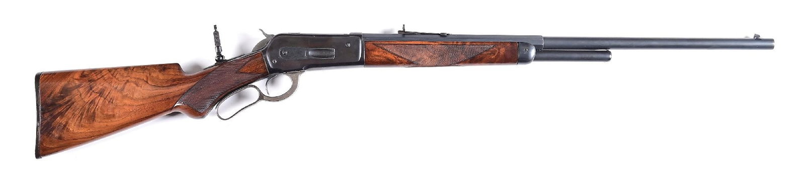 (A) SPECIAL ORDER DELUXE WINCHESTER MODEL 1886 LEVER ACTION RIFLE.: The serial number was applied to this rifle July 8, 1893 and it shipped out as a deluxe gun on July 15. It currently sports a matte blued half octagon barrel with German silver dovetailed blade front