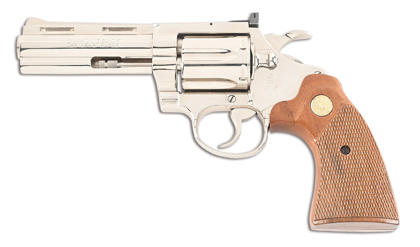 (M) NICKEL COLT DIAMONDBACK .22LR WITH BOX: Manufactured in 1982. This revolver is finish in nickel and sports a matte rib barrel. Standard fixed front sight with an adjustable rear sight. Features checkered 2-piece walnut grips with gold medal