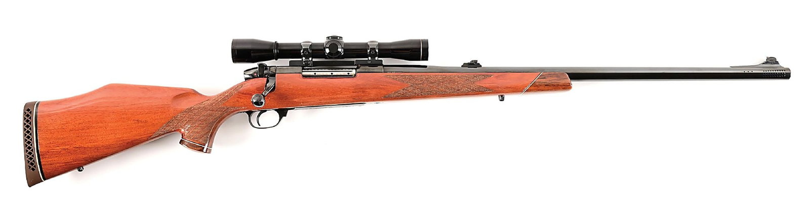 (C) WEST GERMAN WEATHERBY MARK V CUSTOM GRADE BOLT ACTION RIFLE .: Manufactured in 1967 by J.P. Sauer in West Germany. Ported polished blue barrel with ramped blade front sight and folding u-notch rear. Action is also mounted with a gloss finished Leupold M8-4X scope