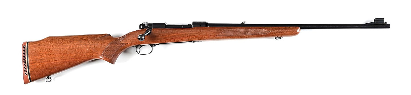 (C) PRE-64 WINCHESTER MODEL 70 WESTERNER FEATHERWEIGHT BOLT ACTION RIFLE IN .264 WINCHESTER MAGNUM: Manufactured 1962. Barrel with ramped and hooded front sight and folding express rear sight. Matte finished receiver with 4 scope mounting holes. Alloy trigger guard and magazine floor plate and Winch