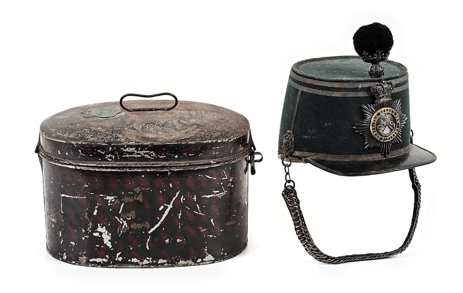 BRITISH VICTORIAN THE QUEEN'S OWN LIGHT INFANTRY SHAKO IN STORAGE TIN.: Victorian officer's 1869 pattern shako of the Queen's Own Light Infantry. Composed of a dark green felt with one strip of gold lace around the lower edge, two strips around the upper edge and a strip