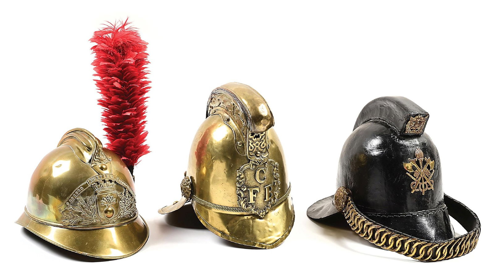 LOT OF 3: 20TH CENTURY FIRE HELMETS.: Lot consists of: (A) French brass fire helmet designed in the style of the Adrian helmet pattern. Complete with brass helmet plate of castle with flaming bomb in shield surrounded by oak leaf branches