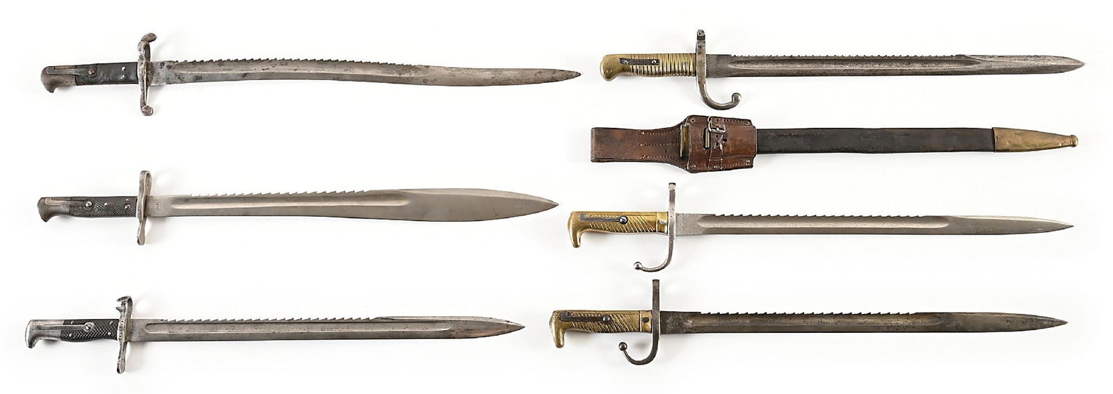 LOT OF 6: SAWBACK SABER BAYONETS.: Lot consists of: (A) British 1856 Enfield bayonet with sawback modification. Unmarked with gray patina throughout. (B) Scarce British 1871 Pattern Elcho sawback bayonet with swollen blade marked with