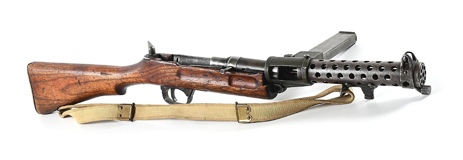 LANCHESTER MK 1 MACHINE GUN PARTS KIT: WWII British Lanchester kit with intact barrel, perforated shroud, cast magazine housing, bolt and finger groove hardwood stock with brass butt plate. Includes a magazine and web sling. CONDITION: Fai