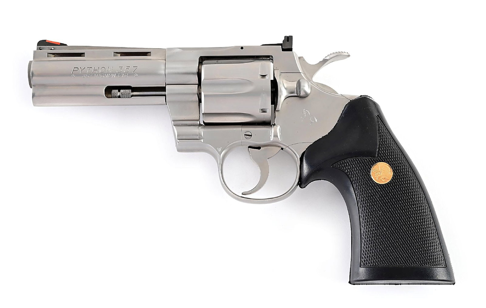 (M) STAINLESS COLT PYTHON DOUBLE ACTION .357 MAGNUM REVOLVER.: Dates from 1985 through 1987. Features the full length vent rib, solid lug, red insert front sight, adjustable rear sight, wide spur hammer and Colt gold medallion rubber grips. Comes in matching numb
