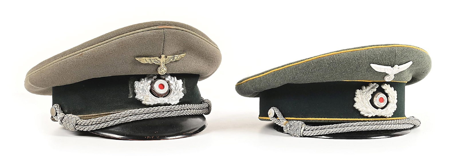 LOT OF 2: GERMAN WWII HEER SIGNAL AND PROPAGANDA OFFICER VISOR CAPS.: Lot contains 2 German WWII Heer officer visor caps: (A) Propaganda officer cap has light gray piping (1 inch of damage on the top front, moth hole on the rear, and heavy wear on the lower rear),