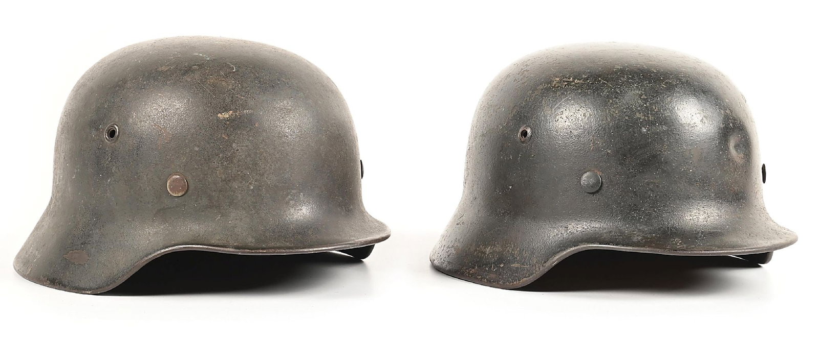 LOT OF 2: GERMAN WWII HEER M40 HELMETS.: Lot consists of: (A) German World War II Heer M40 single decal helmet marked "NS64" for the maker of "Vereinigte Deutsche nickelwerke / Schwerte", in the shell size of "64", and with a lot number of