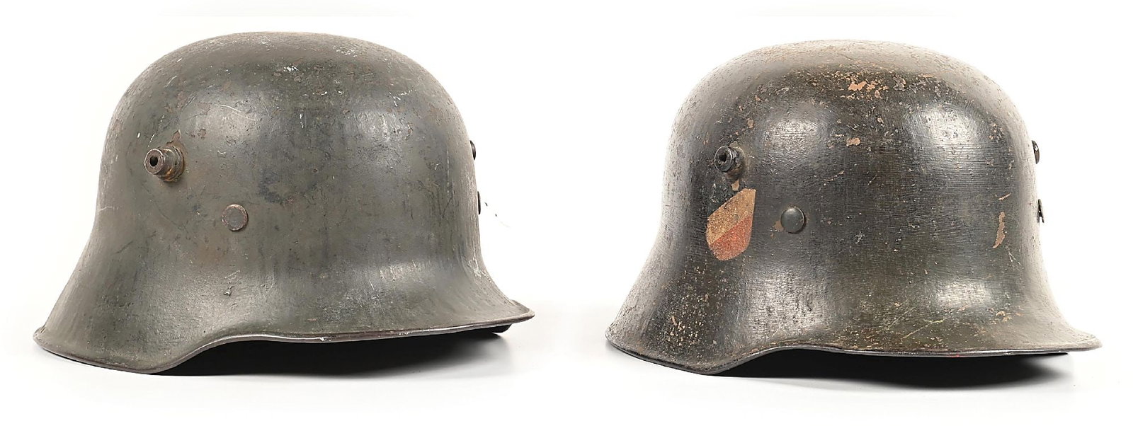 LOT OF 2: GERMAN WWII HEER M18 TRANSITIONAL HELMETS.: Lot consists of: (A) German World War II Heer M18 Transitional single decal helmet marked "B.F.64" for the maker of "F.C. Bellinger, Fulda", and in the shell size of "64". Shell is painted in a rough