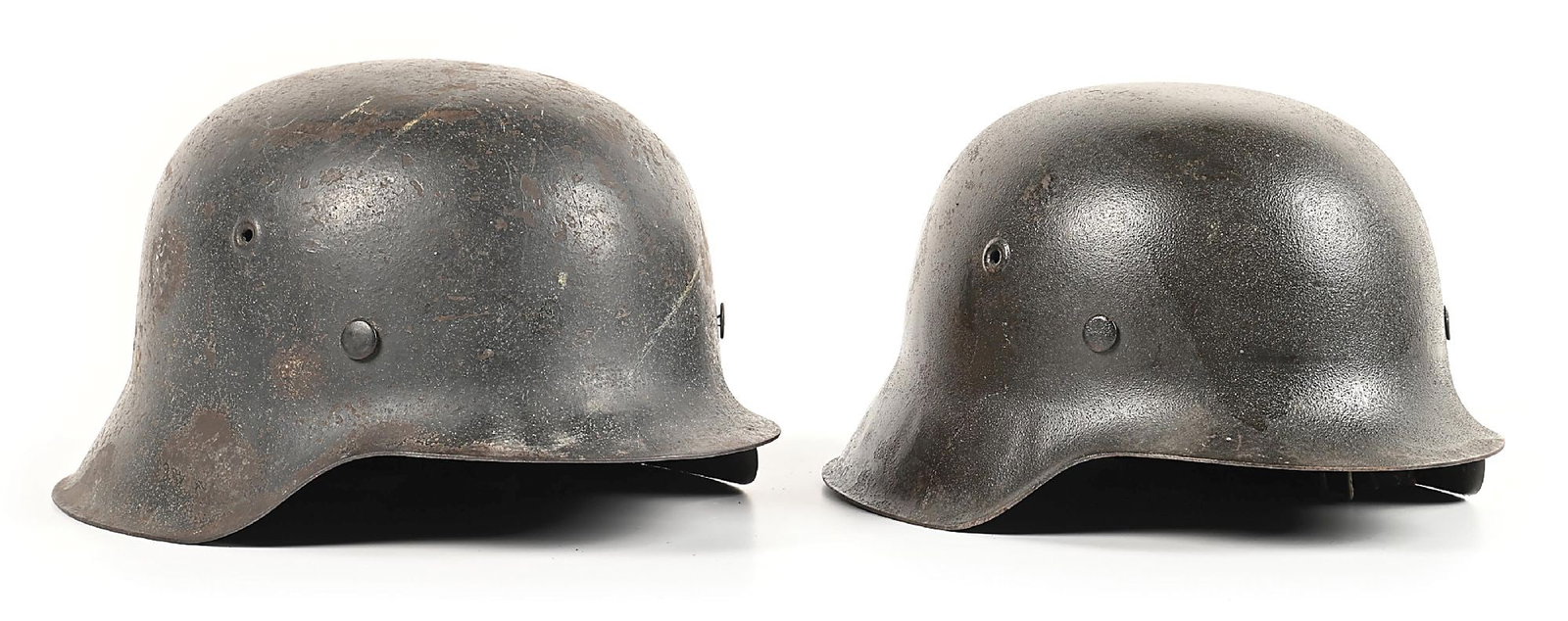 LOT OF 2: GERMAN WWII LUFTWAFFE M42 HELMETS.: Lot consists of (A) German World War II Luftwaffe M42 single decal helmet marked "ckl66" for the maker of "Eisenhüttenwerk Thale / Harz", in the shell size of "66", and with a lot number of