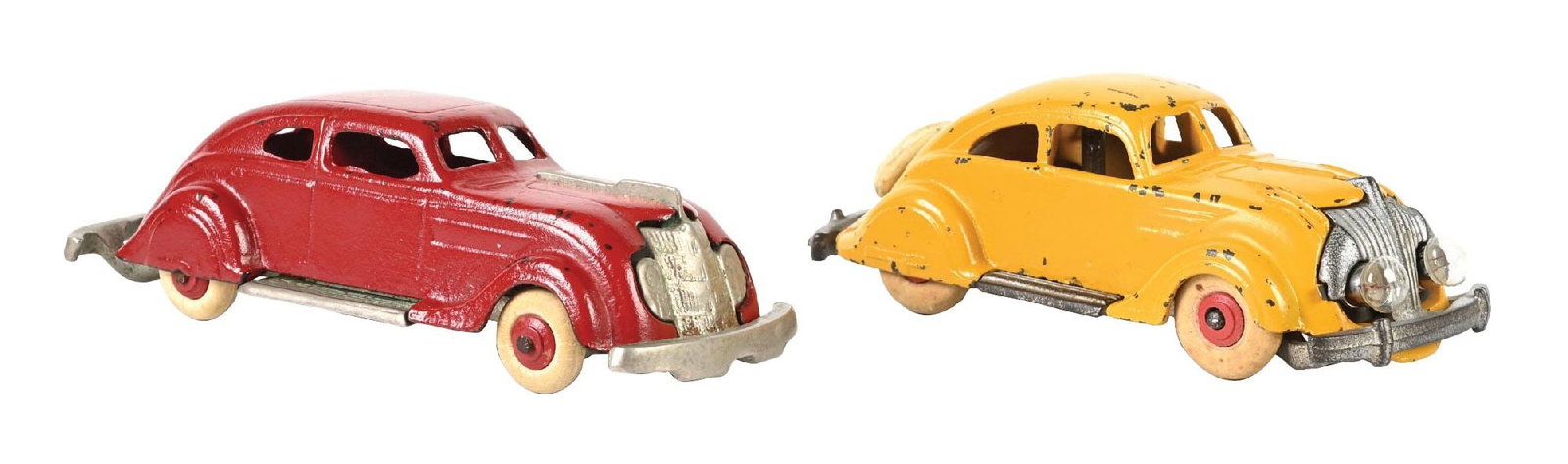 COLLECTION OF 2: PRE-WAR CAST IRON HUBLEY AIR FLOW AUTOMOBILES: (A) The yellow one has battery-operated headlights, marked Hubley on bottom. (B) A red one. Some paint chipping to both. Condition: (Very Good - Excellent). Dimensions: Largest: 6 - 3/4" x 2 - 1/4" x 