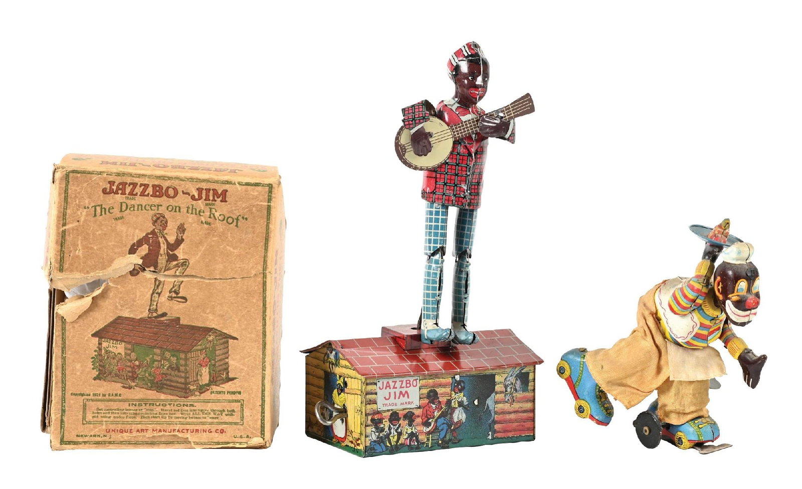 COLLECTION OF 2: AFRICAN-AMERICAN & JAPANESE-MADE WIND-UP TOYS: (A) An Unique Art Jazzbo-Jim dancer on the roof. The original box is missing some pieces and has some tearing. The toy itself looks pretty clean. It has original arms and banjo. Roof needs to be tempe