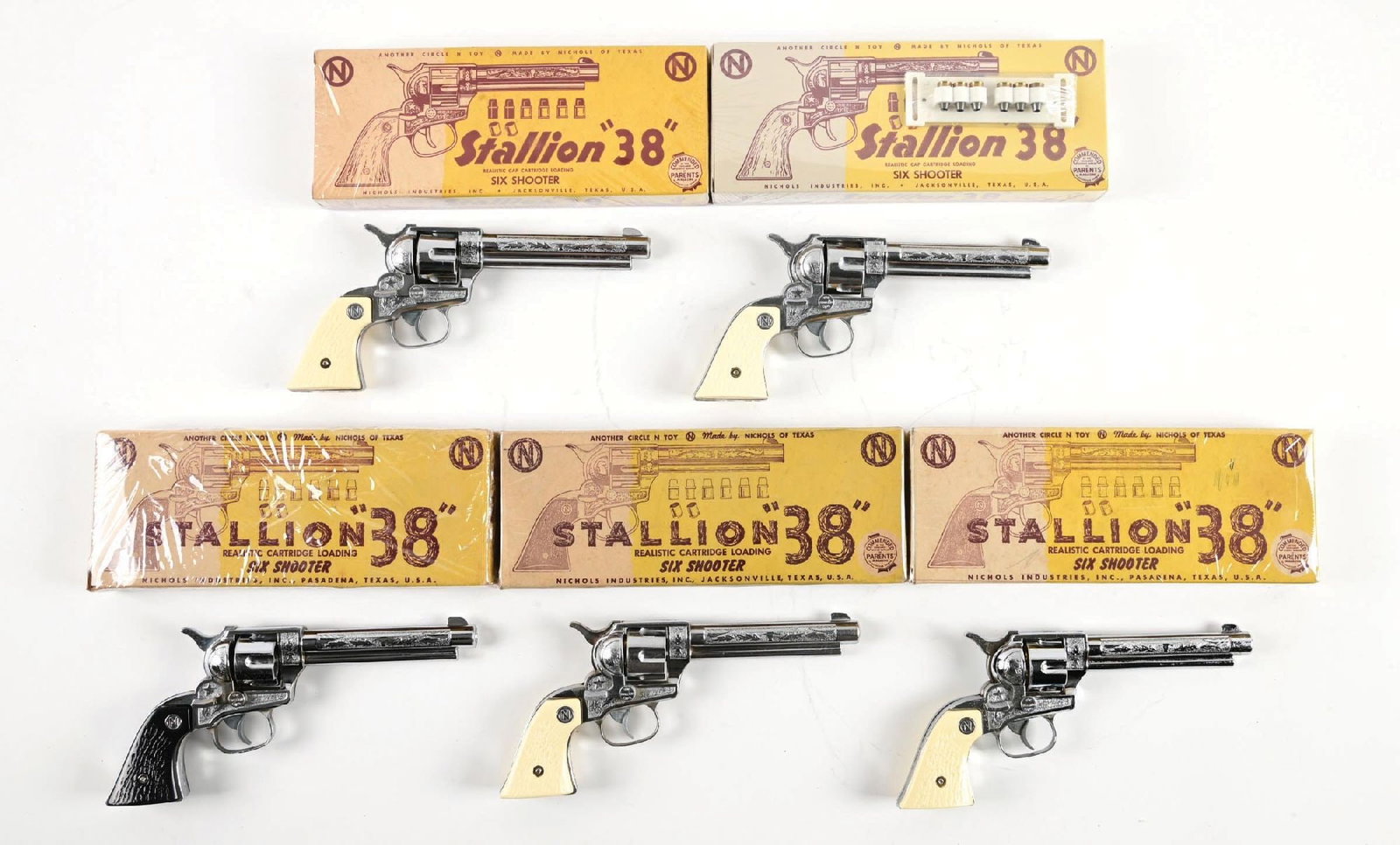 COLLECTION OF 5: VARIOUS VINTAGE NICHOLS CAP GUNS: All six shooters, and boxes marked .38. Look to be all original. Four have white grips, and one has black grips. Condition: (Excellent). Dimensions: Largest Box: 11 - 1/4" x 4 - 7/8" x 3".
