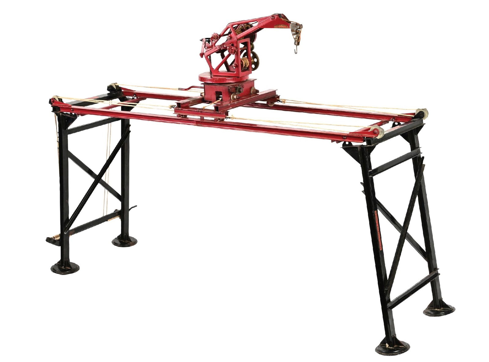 PRE-WAR PRESSED STEEL BUDDY "L" OVERHEAD CRANE: Has replacement brass gears. Complete. Some slight paint loss and wear. This is not a standard shippable item and will require 3rd party shipping or pickup arrangements to be made. Condition: (Very Go