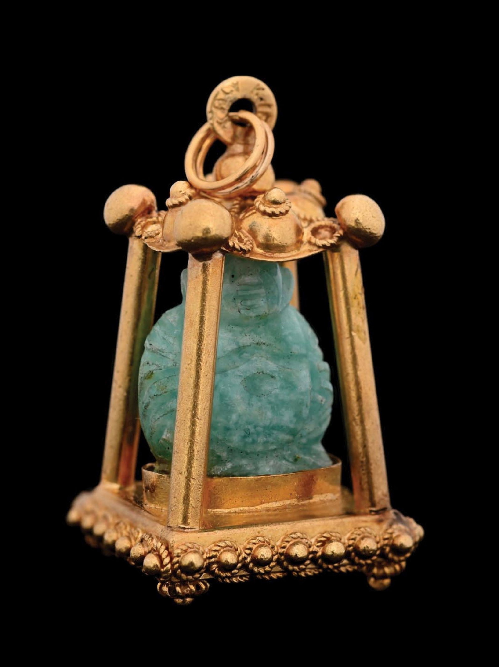 18K GOLD JADE BUDDAH TEMPLE PENDANT: 18k yellow gold temple pendant with carved jade Buddha. Marked "Italy K18". Gross weight is 16.1 grams. 1-1/2" tall by 3/4 wide at base. Condition: (Very Good-Excellent). Dimensions: