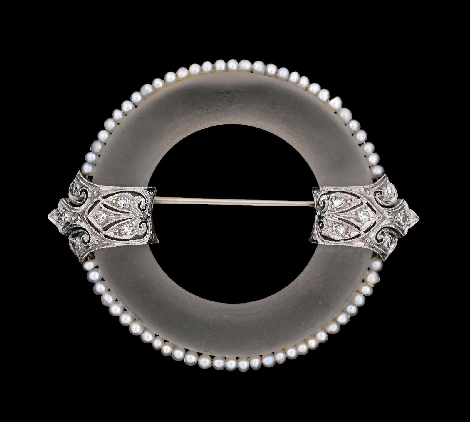 PLATINUM ROCK CRYSTAL BROOCH W/SEED PEARLS & DIAMONDS: Antique platinum rock crystal filagree brooch with diamonds and seed pearls. Diameter measures 1-3/4". Gross weight is 11.2 grams. Unmarked. Condition: (Very Good-Excellent). Dimensions:
