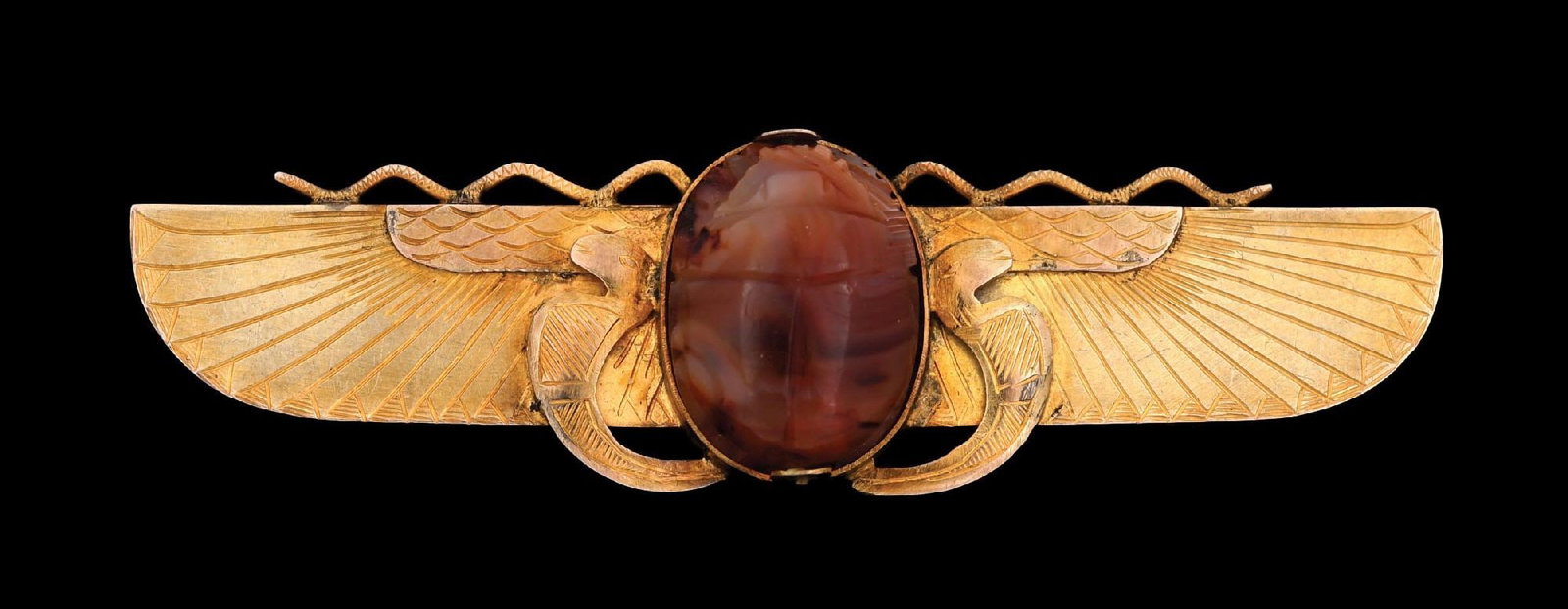 9K GOLD ANTIQUE AGATE SCARAB BROOCH: Wonderful antique 9k yellow gold carved agate Egyptian winged scarab brooch measuring 3-1/8" by 7/8". Gross weight is 13.3 grams. Marked "9K". Condition: (Excellent). Dimensions: