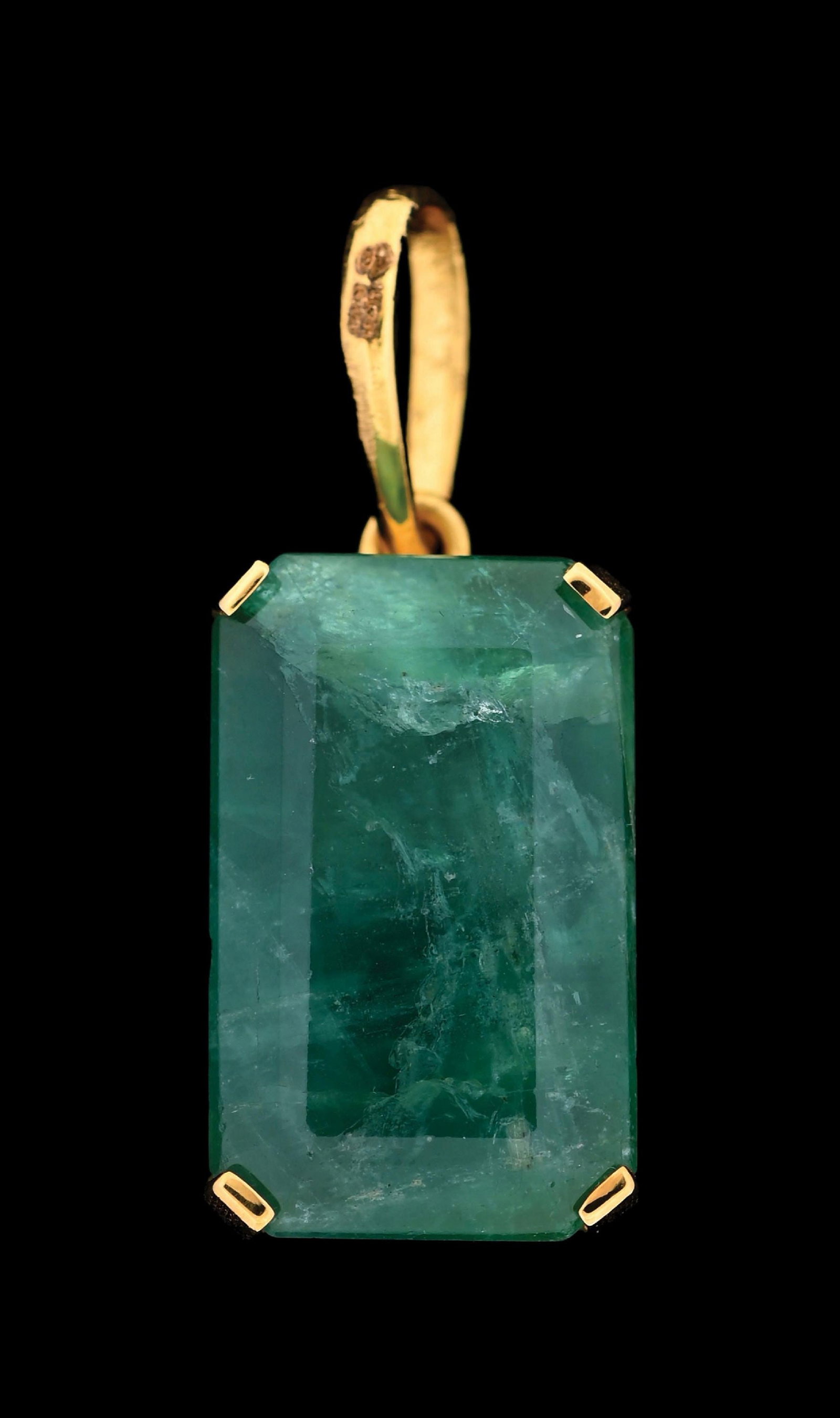 18K GOLD ZAMBIAN EMERALD PENDANT W/REPORT: Ladies' 18k yellow gold Zambian emerald (21.45ct) pendant accompanied by an original AGL laboratory report (See additional website images of report for specifications). Pendant measures 1-1/4" by 1/2"