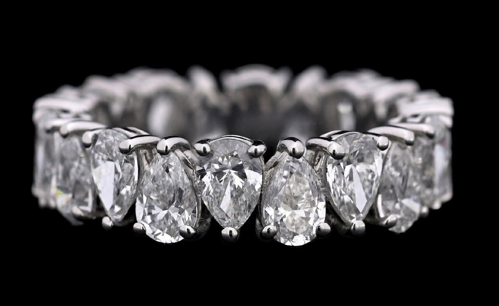 PLATINUM 5CT TW DIAMOND ETERNITY RING: Ladies' platinum diamond eternity ring/band consisting of 20 pear brilliant cut natural diamonds with a total weight of 5.12cts, graded F/G, VS2. Gross weight is 6.0 grams. Finger size 6-1/2. Width me