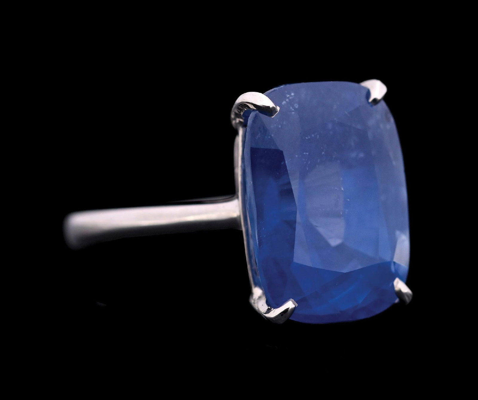 18K WHITE GOLD CEYLON SAPPHIRE RING W/GIA REPORT: Ladies' 18k white gold Ceylon (Sri Lanka) 12.79ct blue sapphire ring accompanied by an original GIA sapphire origin report (See additional website images of report for specifications). Finger size 7. 
