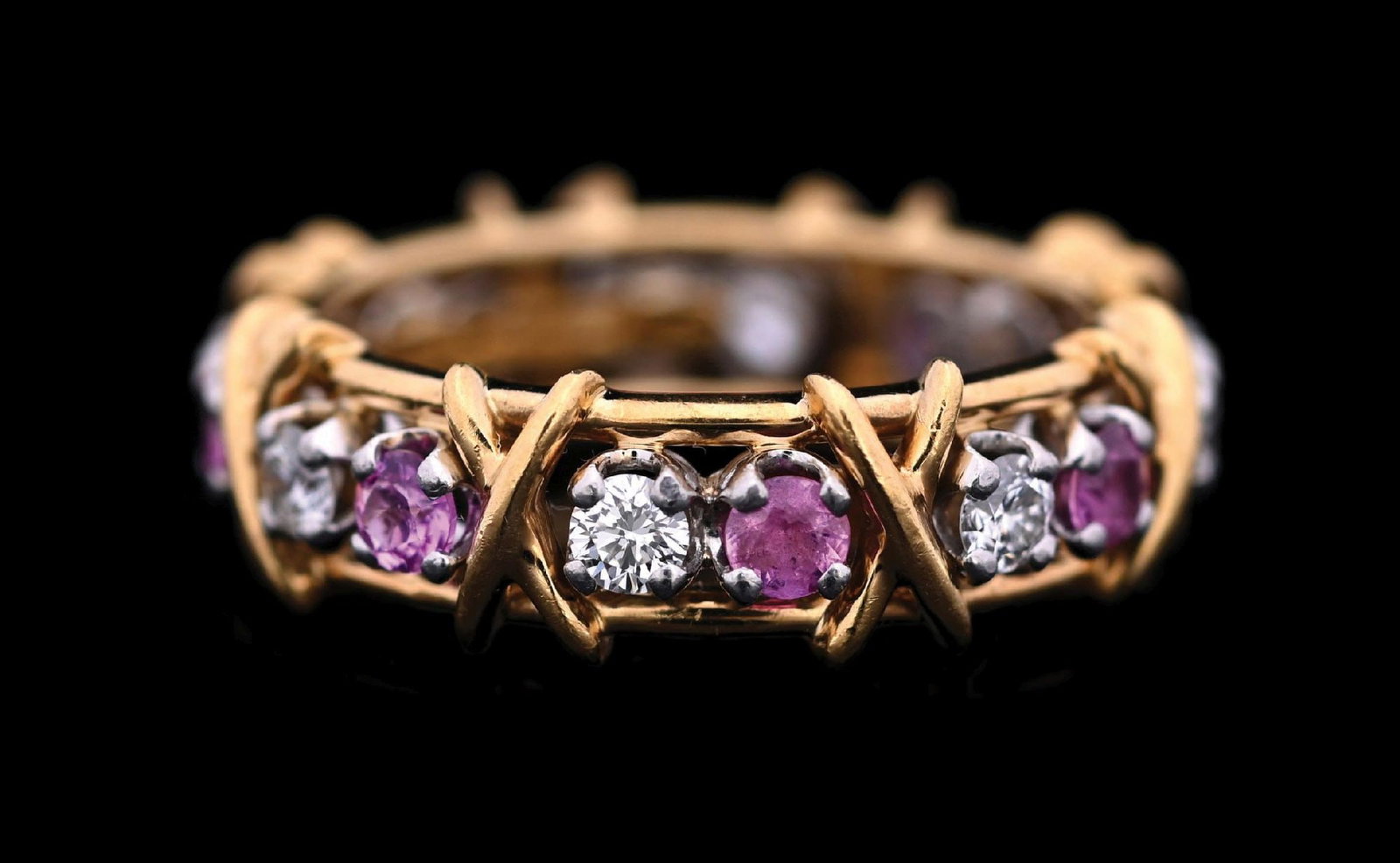 TIFFANY & CO. SCHLUMBERGER STUDIOS 18K GOLD & PLARINUM RUBY & DIAMOND X RING: Ladies' Schlumberger Studios for Tiffany & Co. ruby and diamond "X" band in 18k yellow gold and platinum, set with 8 round brilliant cut natural diamonds measuring approximately 2.75mm each, with an e
