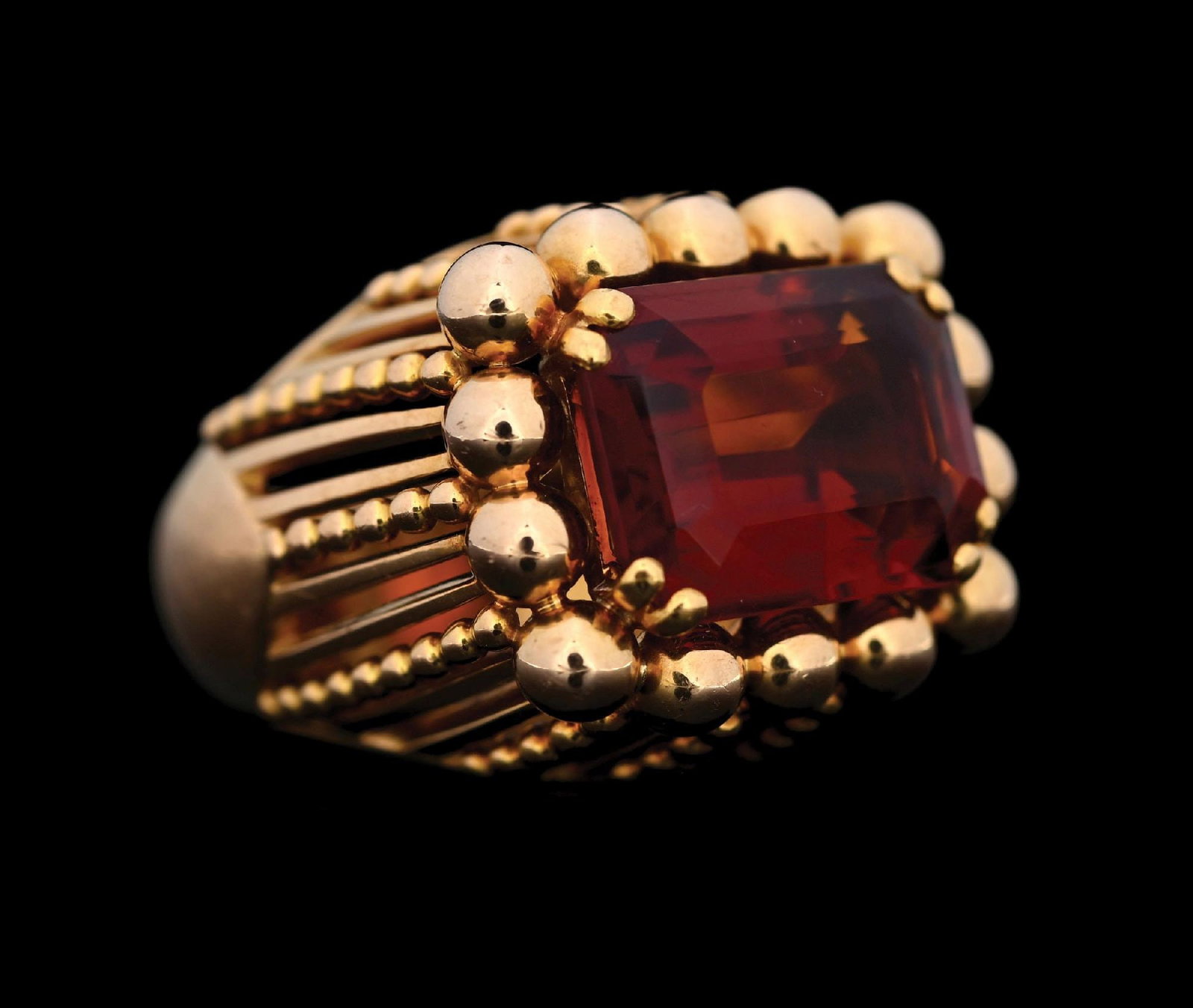 18K YELLOW GOLD FRENCH CITRINE RING: Ladies' 18k yellow gold citrine ring consisting of 1 emerald cut citrine measuring approximately 13.8 x 10.4. Ring size 4-1/4. Gross weight is 21.9 grams. Width at top measures 18mm. Unmarked, tested