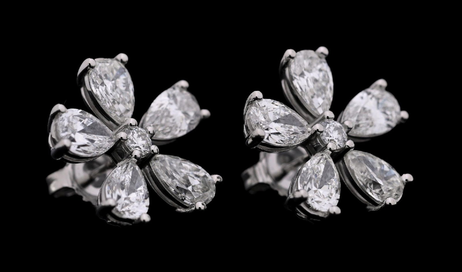 PLATINUM 5.50CT TW DIAMOND FLOWER EARRINGS: Ladies' platinum diamond flower earrings consisting of 12 mixed pear brilliant cut and round brilliant cut natural diamonds with a total weight of 5.50cts, graded G/H,VS. Gross weight is 7.0 grams.
