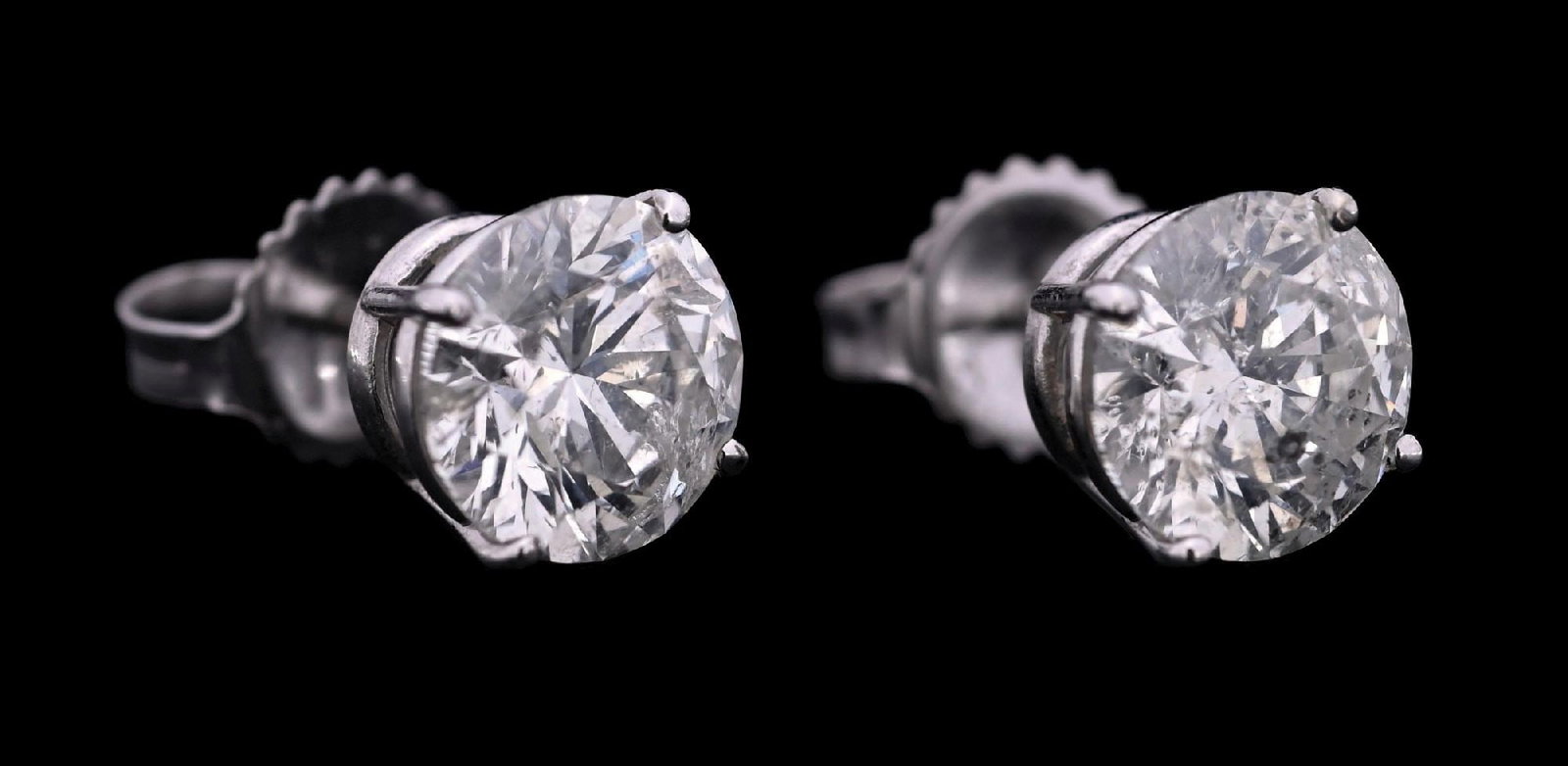14K WHITE GOLD +3CT TW DIAMOND STUD EARRINGS W/REPORT: 14k white gold diamond (3.13ctw) stud earrings accompanied by an original AIGL appraisal report with an ERRV of $28,740.00 (See additional website images of report for specifications). Width measures 