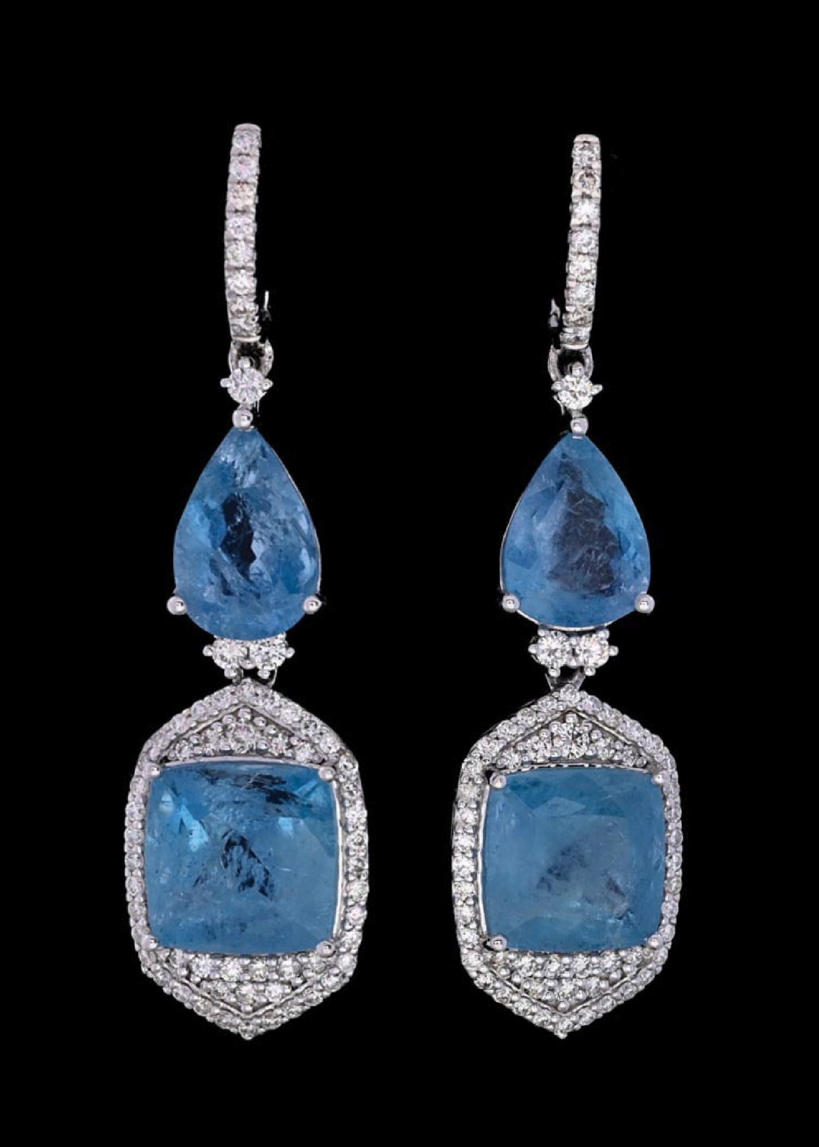 PLATINUM AQUAMARINE & DIAMOND EARRINGS W/REPORT: Ladies' platinum aquamarine (12.10ctw) and diamond (1.03ctw) earrings accompanied by an original GGA appraisal report with an ERRV of $20,940.00 (See additional website images of report for specificat