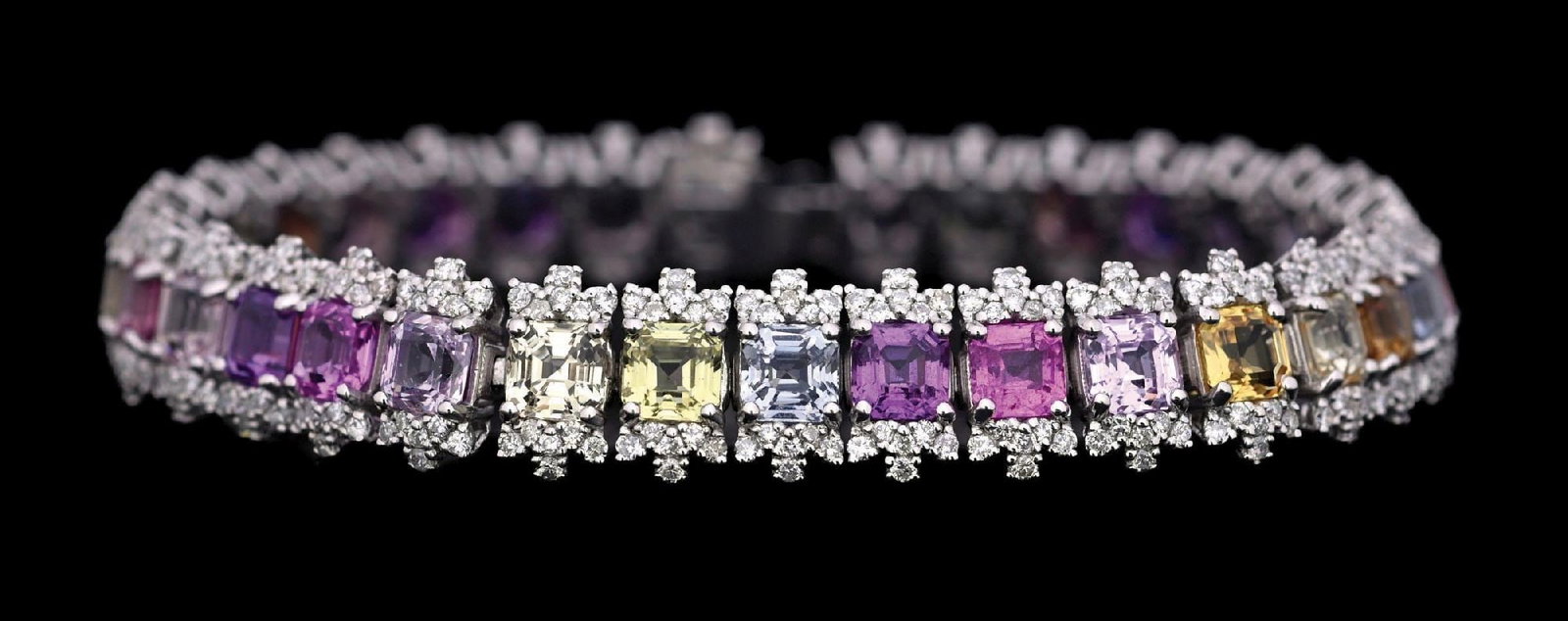 PLATINUM MULTI-COLOR SAPPHIRE & DIAMOND BRACELET W/GIA REPORT: Ladies' platinum natural multi-color sapphire (20.54ctw) and diamond (2.65ctw) bracelet accompanied by an original GIA sapphire origin report and a GGA appraisal report with an ERRV of $51,290.00 (See