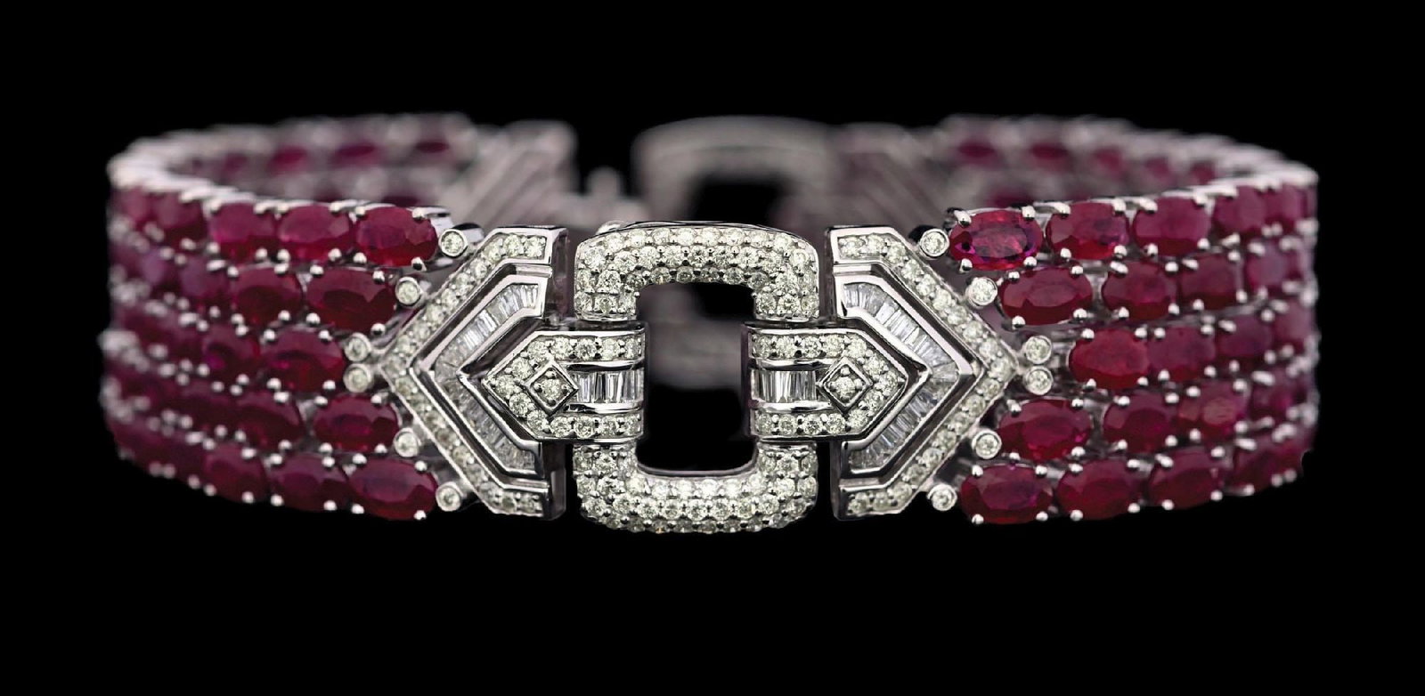 14K WHITE GOLD RUBY & DIAMOND BRACELET W/REPORT: Ladies' 14k white gold ruby (33.86ctw) and diamond (2.45ctw) vintage style bracelet accompanied by an original AIGL appraisal report with an ERRV of $62,755.00 (See additional website images of report