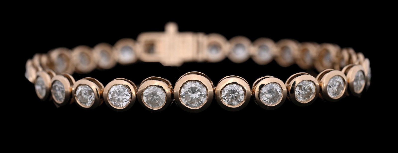 14K GOLD BEZEL-SET DIAMOND BRACELET W/REPORT: Ladies' 14k yellow gold diamond (8.92ctw) bracelet accompanied by an original GGA appraisal report with an ERRV of $41,790.00 (See additional website images of reports for specifications). Width measu