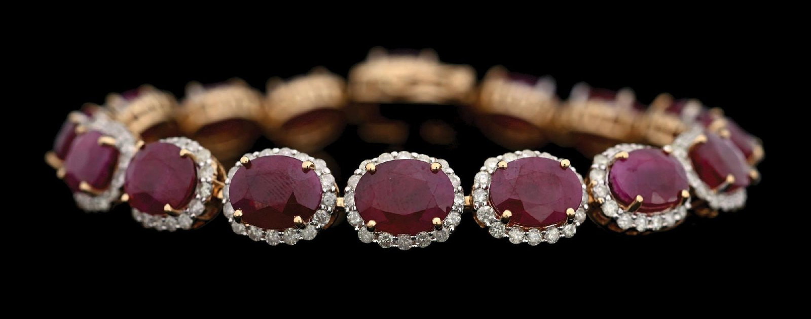14K GOLD BURMESE RUBY & DIAMOND BRACELET W/GIA REPORT: Ladies' 14k yellow gold Burmese ruby (33.14ctw) and diamond (3.55ctw) bracelet accompanied by an original GIA ruby origin report and a GGA appraisal report with an ERRV of $28,790.00 (See additional w