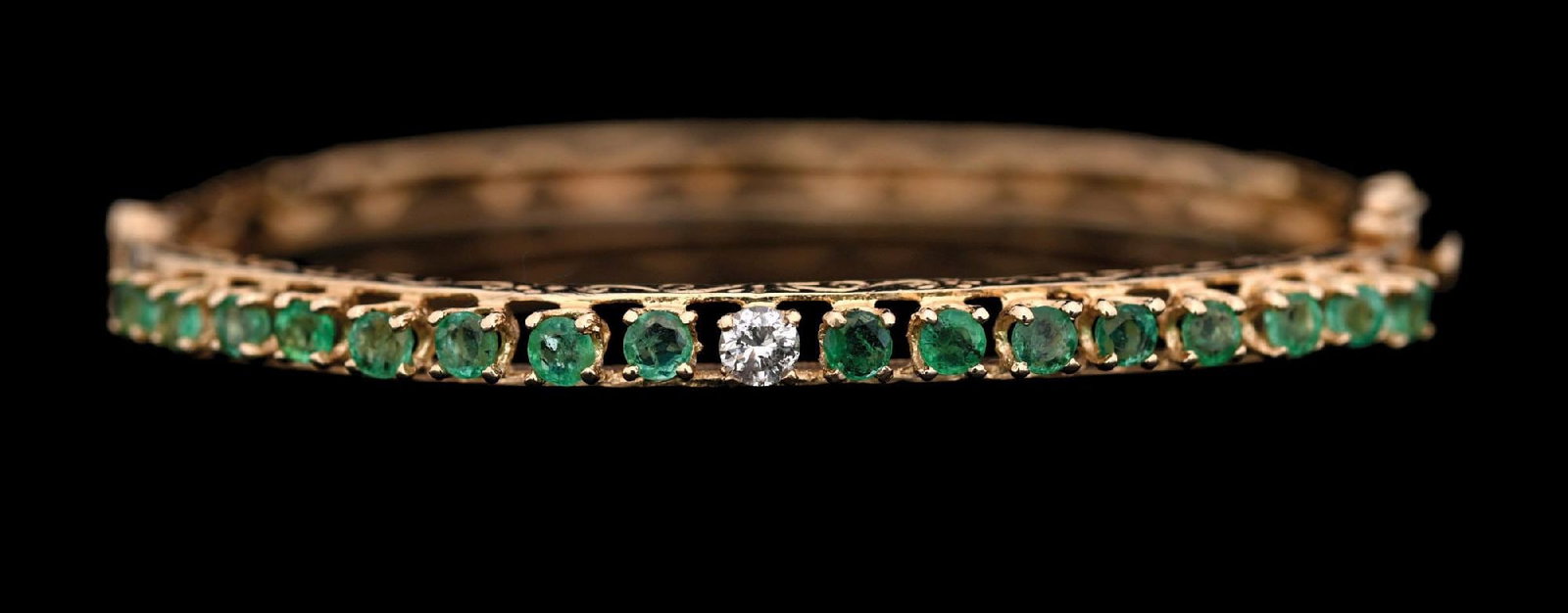 14K GOLD EMERALD & DIAMOND BANGLE BRACELET: Ladies' 14k yellow gold emerald & diamond and emerald bangle bracelet. Inside diameter measures 2-1/4". Width measures 4.3mm. Gross weight is 10.9 grams. Marked "14K". Condition: (Very Good). Dimensio
