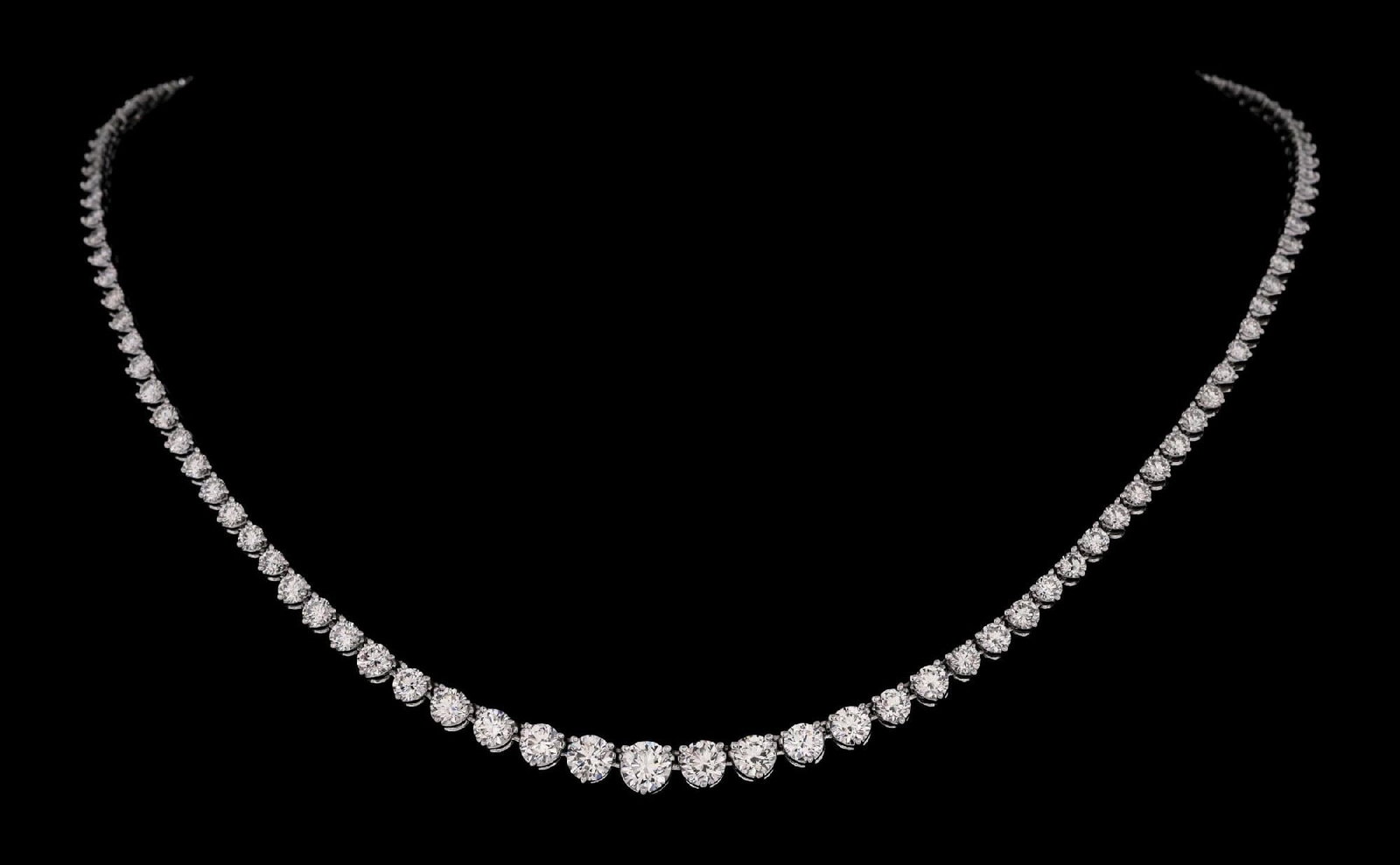 14K WHITE GOLD 10CT TW DIAMOND RIVIERA NECKLACE: Ladies' 14k white gold graduated diamond riviera necklace consisting of 121 round brilliant cut natural diamonds with a total weight of 10.25cts, graded H, VS. Gross weight is 24.0 grams. Length measu