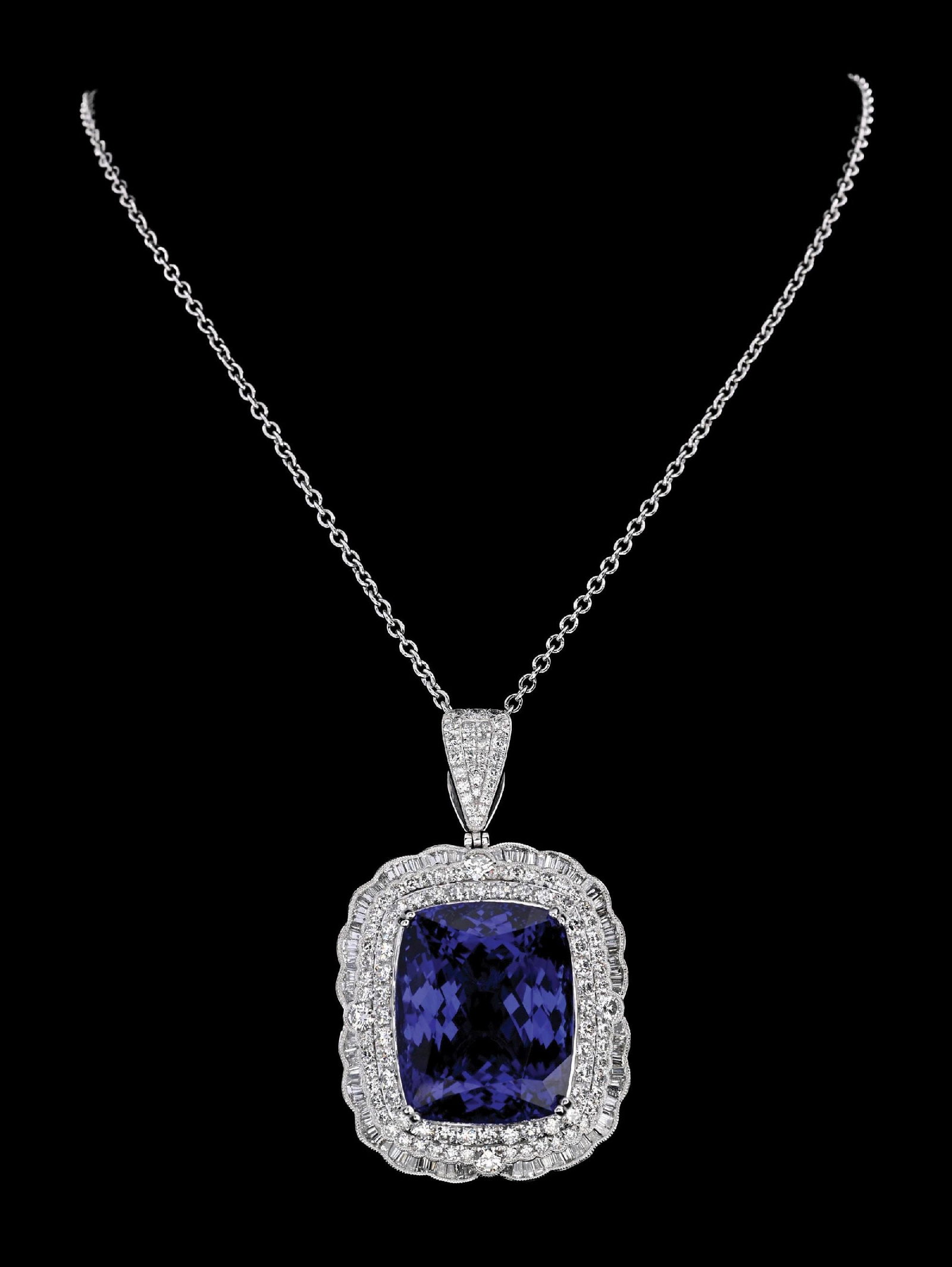 PLATINUM 86CT TANZANITE & DIAMOND NECKLACE W/GIA REPORT: Ladies' stunning platinum tanzanite (85.72ct) and diamond (6.97ctw) pendant and chain accompanied by an original GIA identification report and a GGA appraisal report with an ERRV of $392,460.00 (See a