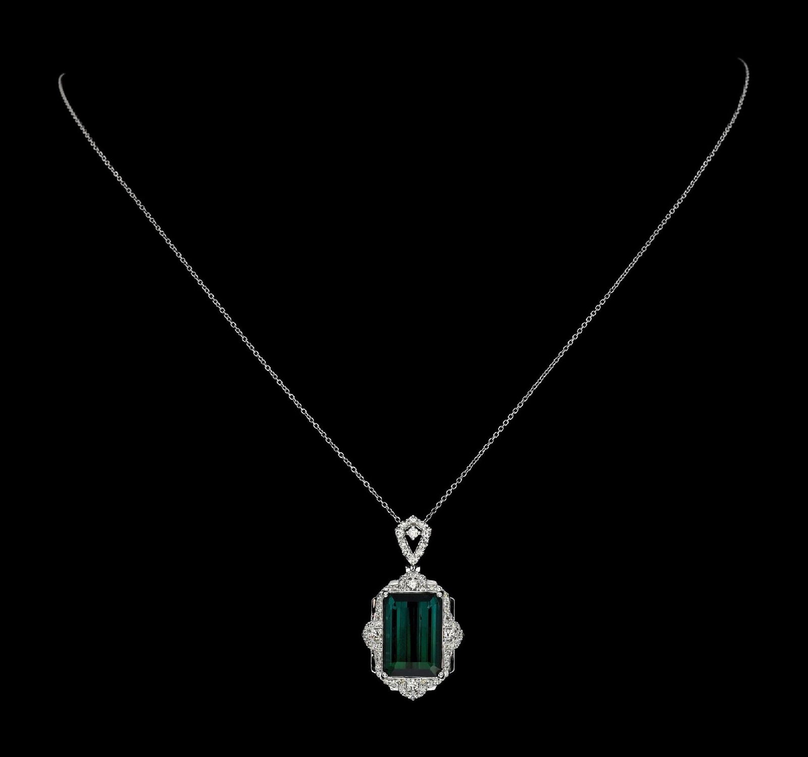 PLATINUM GREENISH-BLUE TOURMALINE & DIAMOND NECKLACE W/REPORT: Ladies' platinum greenish-blue indicolite tourmaline (9.29ct) and diamond (0.54ctw) pendant and chain accompanied by an original AIGL appraisal report with an ERRV of $17,434.00 (See additional websit