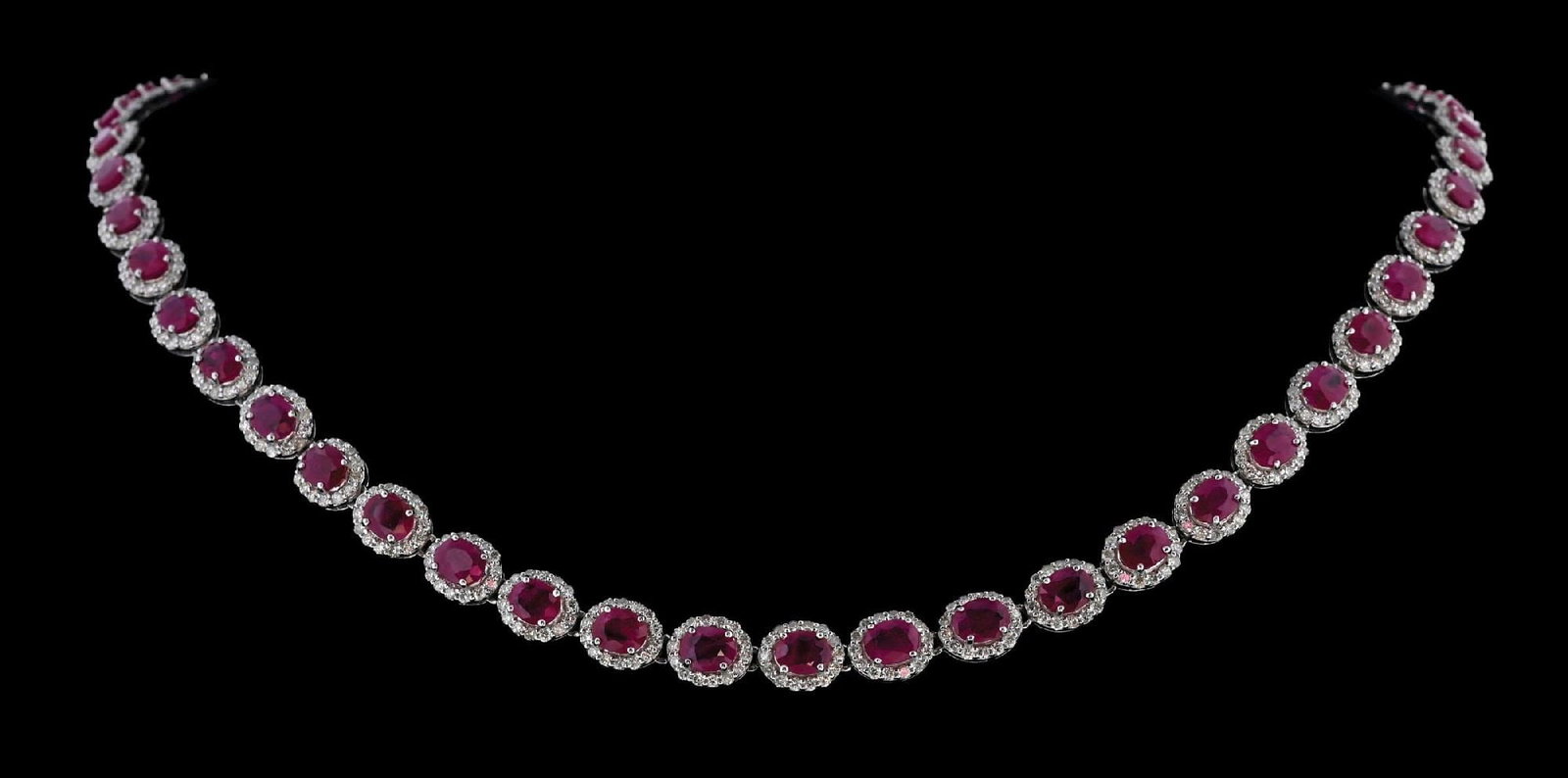 PLATINUM BURMESE RUBY & DIAMOND NECKLACE W/GIA REPORT: Ladies' platinum Burmese ruby (18.67ctw) and diamond (5.81ctw) necklace accompanied by an original GIA ruby origin report and a GGA appraisal report with an ERRV of $71,290.00 (See additional website 
