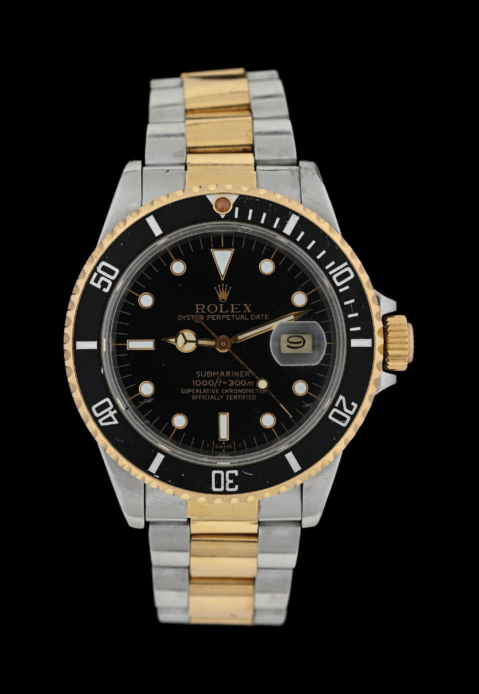 ROLEX OYSTER PERPETUAL BLACK SUBMARINER IN STEEL & GOLD, REF. 16803 W/BOX: Rolex 40mm Oyster Perpetual Black Submariner wristwatch in 18k yellow gold stainless steel with black "T SWISS T" dial. Reference number 16803, serial number 86506## (C. 1985). Powered by Rolex's cali