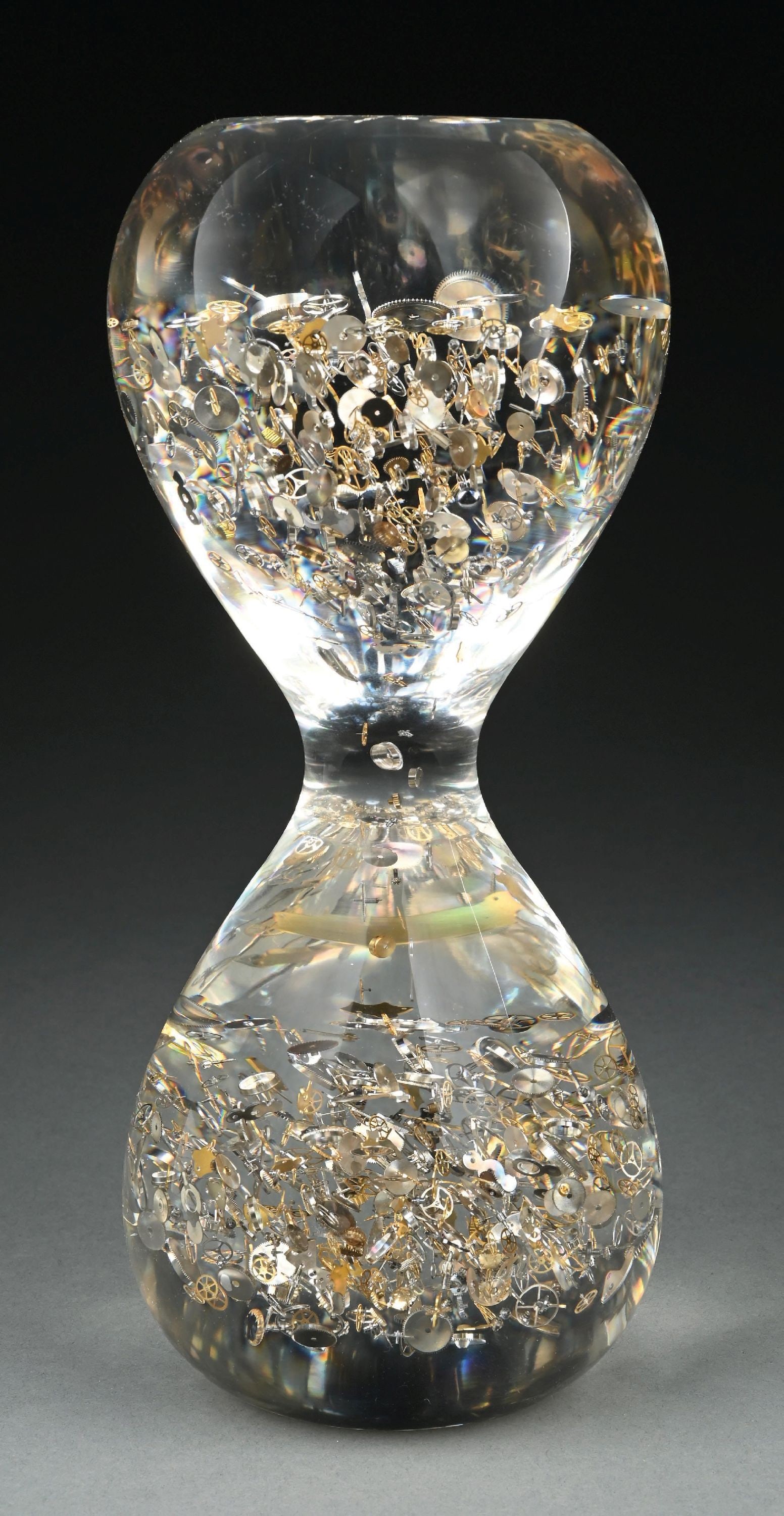 BERD VAYE PASSAGE THROUGH TIME LARGE HOURGLASS SCULPTURE W/CASE: Berd Vay'e "Passage Through Time" large hourglass sculpture in lucite and vintage watch components with original fitted case. Limited edition of 999 pieces, this sculpture is numbered 190/999. Hourgla