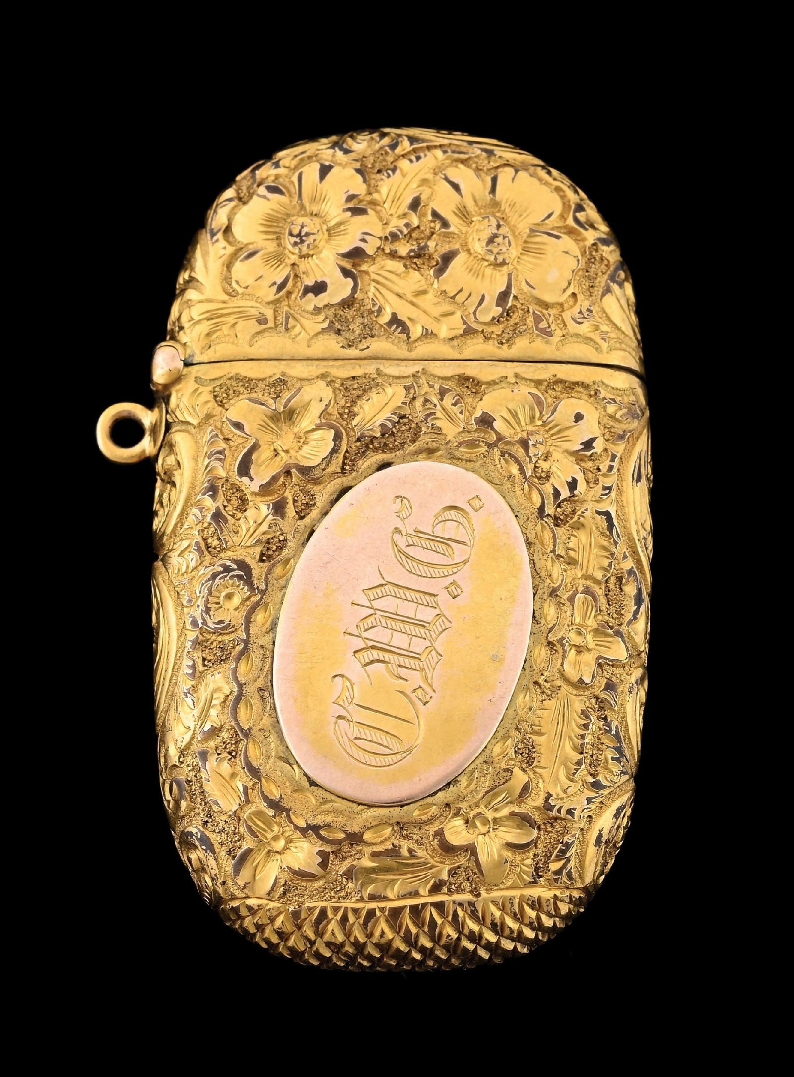 15K GOLD MATCH SAFE: Intricate floral design. Tests for 15K gold. 19.8 grams. From the portfolio of an avid and dedicated collector. Condition: (Excellent). Dimensions: 1 - 1/4" x 2 - 1/4".