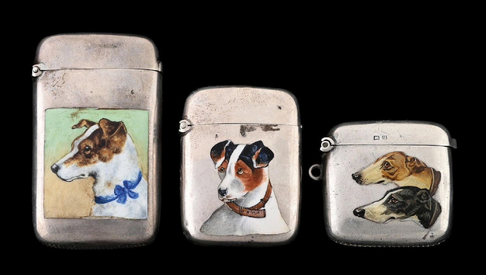 COLLECTION OF 3: ENGLISH ENAMELED & STERLING SILVER MATCH SAFES: Nice lot of 3 English enameled sterling match safes with dog motifs. From the portfolio of an avid and dedicated collector. Condition: Dimensions: Largest: 1 - 1/2" x 2 - 1/2".