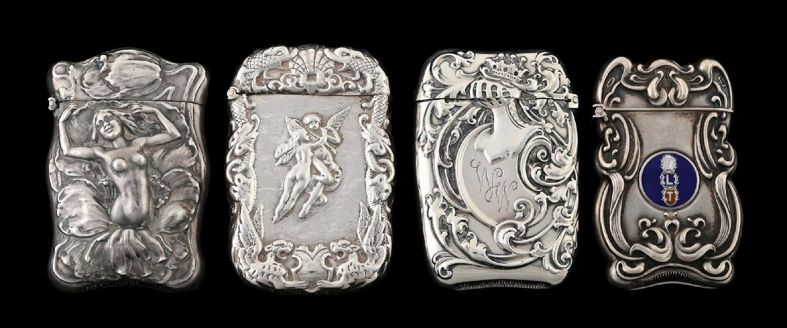 COLLECTION OF 4: STERLING SILVER ART NOUVEAU MATCH SAFES: Includes a nude, a pair of cherubs and two with scrolling designs. From the portfolio of an avid and dedicated collector. Condition: Dimensions: Largest: 1 - 3/4" x 2 - 3/4".