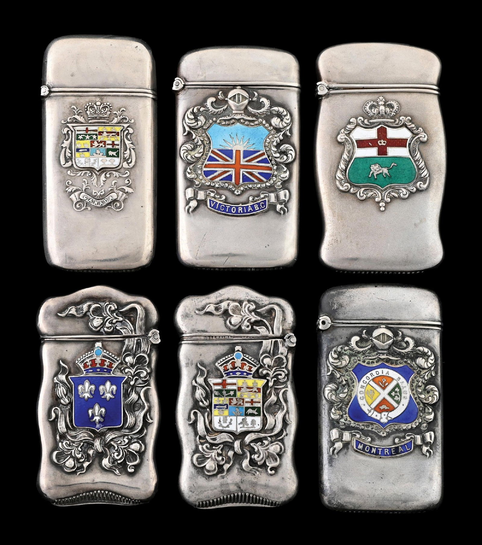 COLLECTION OF 6: STERLING SILVER MATCH SAFES W/ ENAMEL CRESTS RODEN BROS.: Nice grouping. Detailed color enameling. From the portfolio of an avid and dedicated collector. Condition: Dimensions: Largest: 1 - 1/2" x 2 - 1/2".
