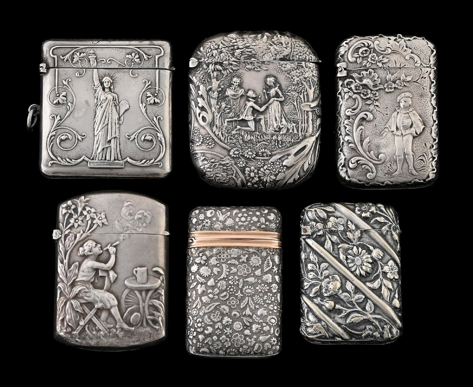 COLLECTION OF 6: FRENCH STERLING SILVER MATCH SAFES: Includes Statue of Liberty and lady smoking in garden. From the portfolio of an avid and dedicated collector. Condition: Dimensions: Largest: 1 - 1/2" x 2".