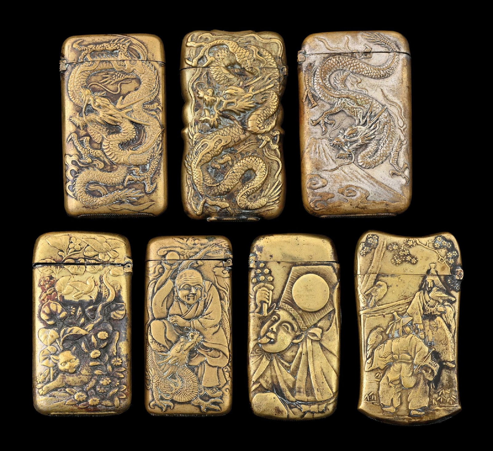 COLLECTION OF 7: JAPANESE BRASS MATCH SAFES: One with working compass. From the portfolio of an avid and dedicated collector. Condition: Dimensions: Largest: 1 - 1/2" x 2 - 1/2".