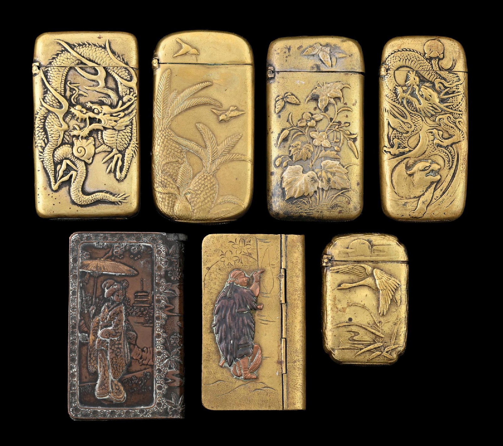 COLLECTION OF 7: JAPANESE BRASS MATCH SAFES: Nice grouping of Japanese match safes. Great detail. From the portfolio of an avid and dedicated collector. Condition: Dimensions: Largest: 1 - 1/2" x 2 - 1/2".