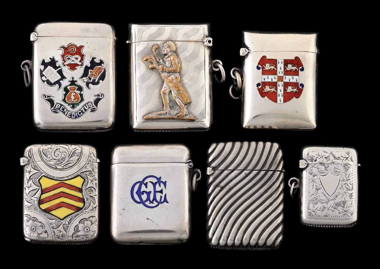 COLLECTION OF 7: ENGLISH STERLING SILVER MATCH SAFES: Includes enamel, coat of arms, golfer. From the portfolio of an avid and dedicated collector. Condition: Dimensions: Largest: 1 - 1/2" x 2".